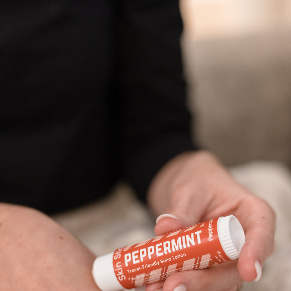 The Peppermint Pucker and Skin Stick bundle in use — cooling peppermint for lips and hands in two twist-up tubes. Rinse Bath & Body Co.
