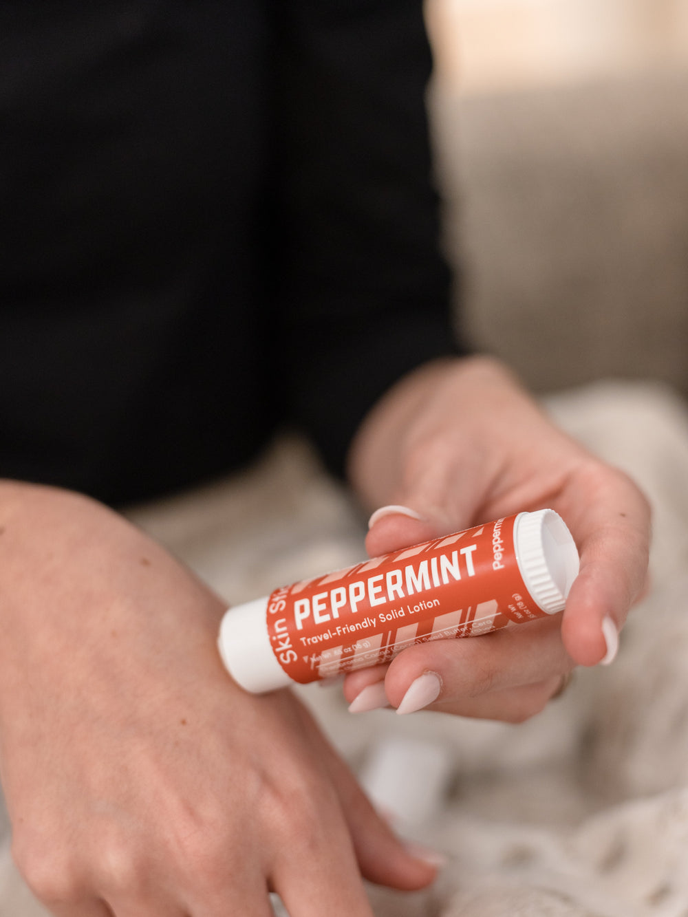 The Peppermint Pucker and Skin Stick bundle in use — cooling peppermint for lips and hands in two twist-up tubes. Rinse Bath & Body Co.