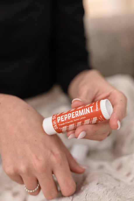 The Peppermint Pucker and Skin Stick bundle in use — cooling peppermint for lips and hands in two twist-up tubes. Rinse Bath & Body Co.