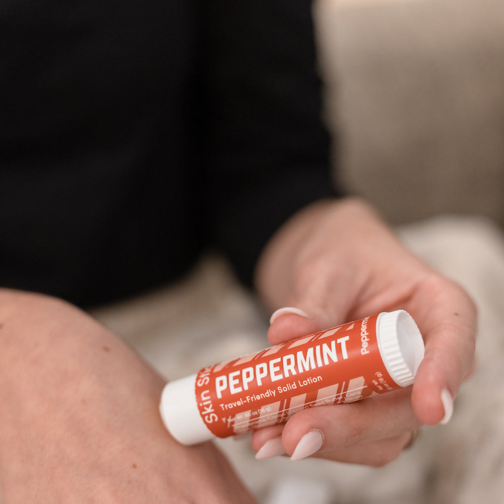 The Peppermint Pucker and Skin Stick bundle in use — cooling peppermint for lips and hands in two twist-up tubes. Rinse Bath & Body Co.