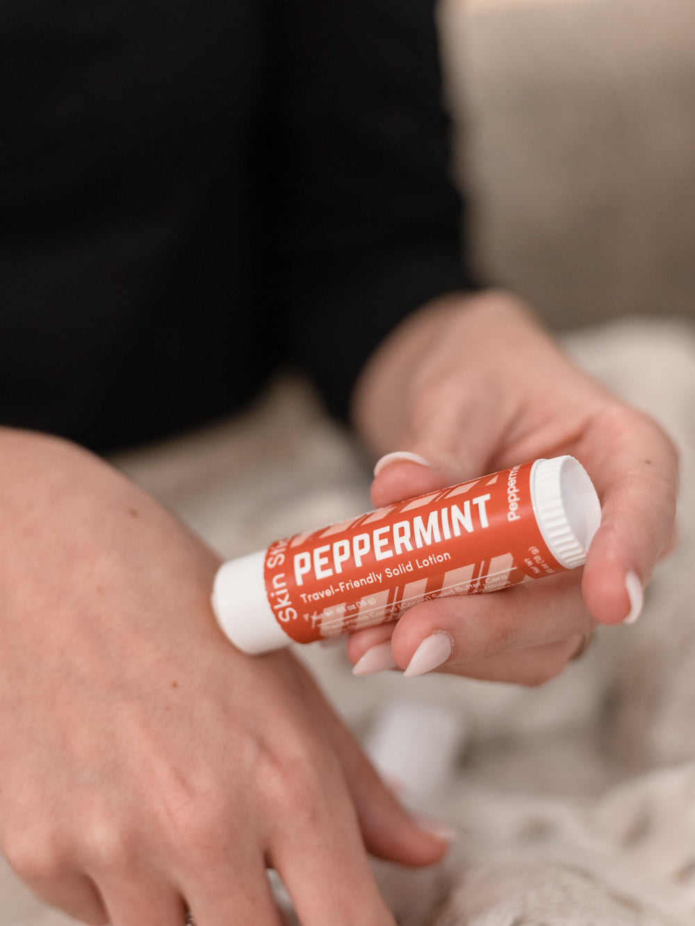 The Peppermint Pucker and Skin Stick bundle in use — cooling peppermint for lips and hands in two twist-up tubes. Rinse Bath & Body Co.