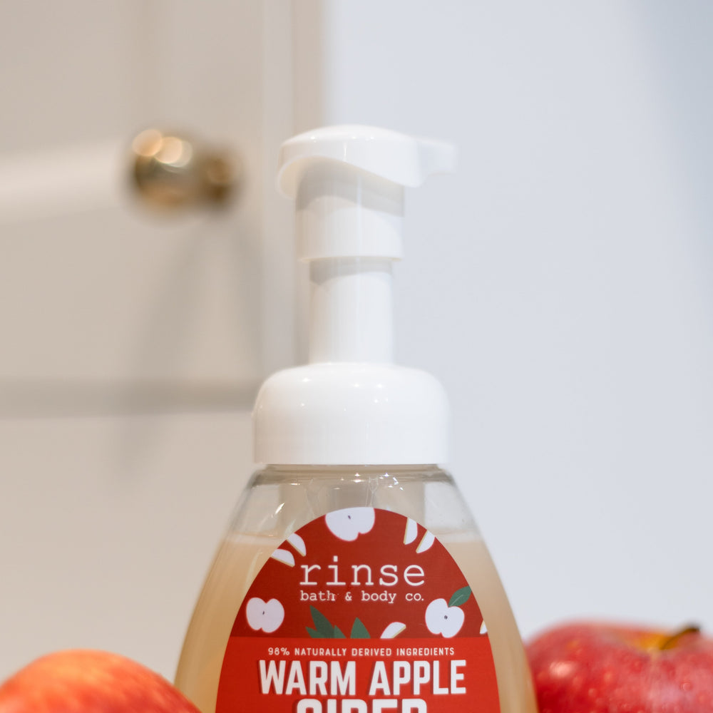 Warm Apple Cider Foaming Hand Soap styled styled with apples — Rinse Bath & Body Co.