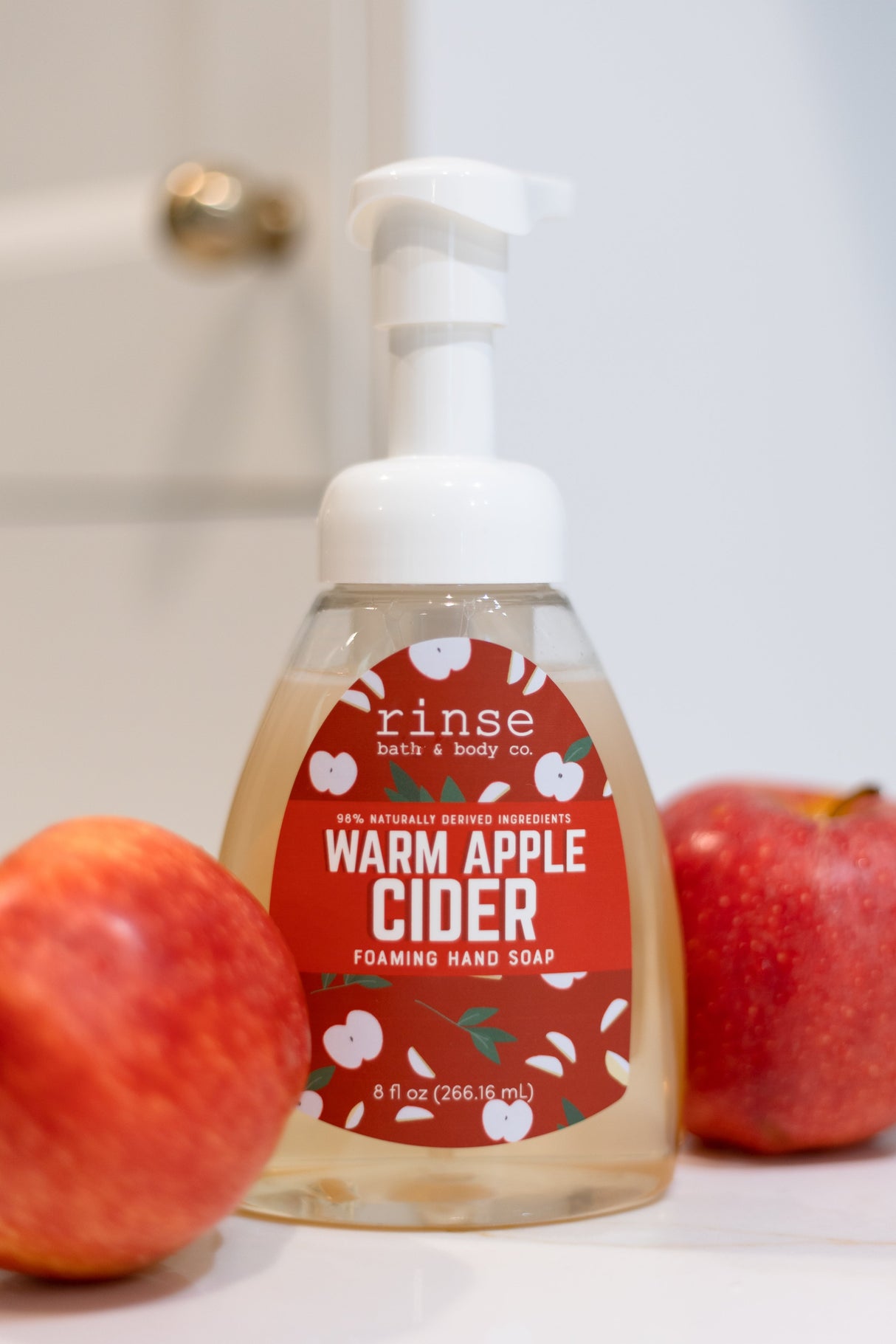 Warm Apple Cider Foaming Hand Soap styled styled with apples — Rinse Bath & Body Co.