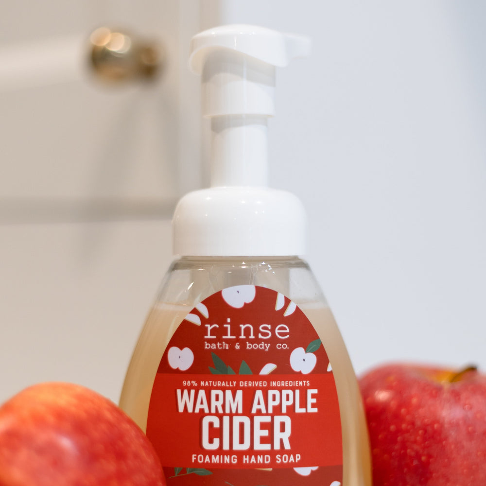 Warm Apple Cider foaming hand soap styled with whole apples
