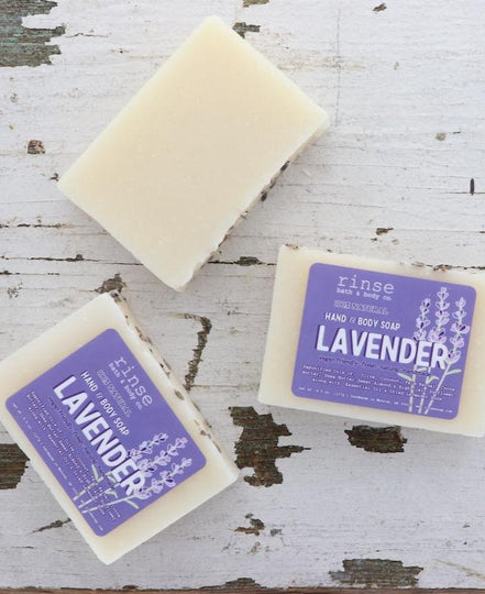 3 lavender soap bars on a chipped wooden background