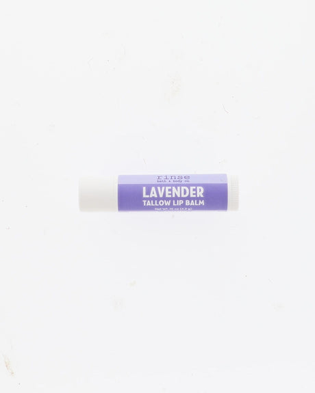 A single tube of lavender tallow lip balm with a purple label and white cap, centered on a plain white background.