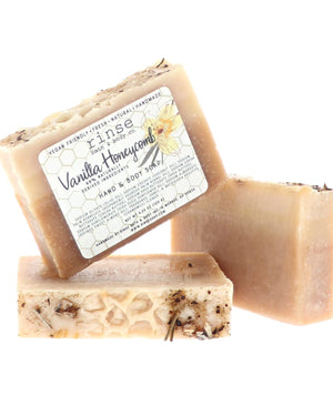 Vanilla Honeycomb bars stacked to show the honey-gold swirl running through the pour. Rinse Bath & Body Co.