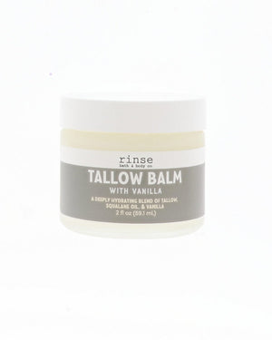 A small white plastic jar of Rinse Tallow Balm with Vanilla on a solid white background.