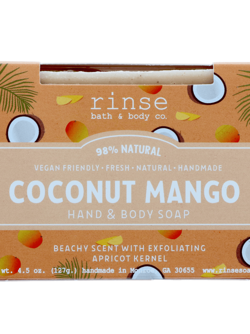 Coconut Mango soap sleeve on dark green — palm fronds, coconut halves, and mango graphics with soap peeking through