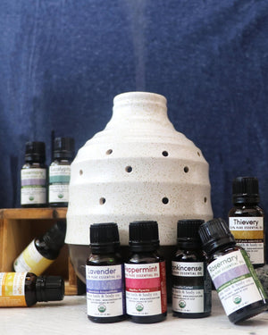 Aller-Ease essential oil in its amber dropper bottle with the USDA organic seal — undiluted, made for a diffuser. Rinse Bath & Body Co.