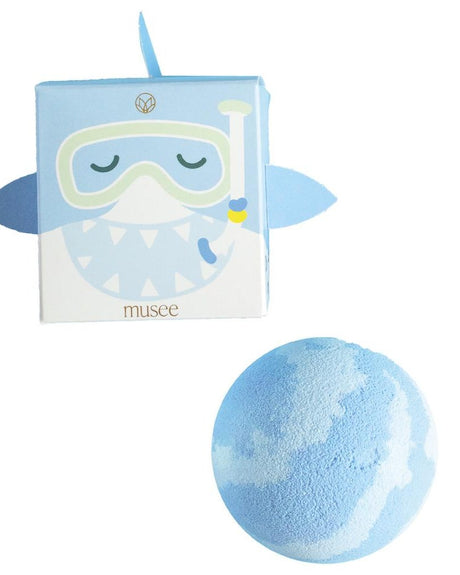 Baby Shark bath balm wrapped pack on bright white — Musée fizzy moisturizing soak.