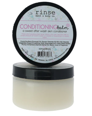 Conditioning Balm jars stacked on white — clear tub of creamy balm with pink label in bright studio light