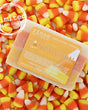 Candy Corn bar soap in its layered orange, yellow and white pour — a Halloween bar that looks like the candy and smells like vanilla sugar. Rinse Bath & Body Co.