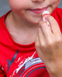 Cherry Rancher Lip Balm in use — Rinse Bath & Body Co.