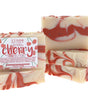 Four Cherry soap bars stack showing creamy red marble — cherry label crisp on clean bright white