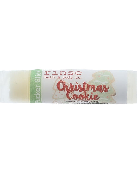 Christmas Cookie lip balm in its festive tube — sugar cookies fresh from the oven, in a cocoa-butter balm. Rinse Bath & Body Co.