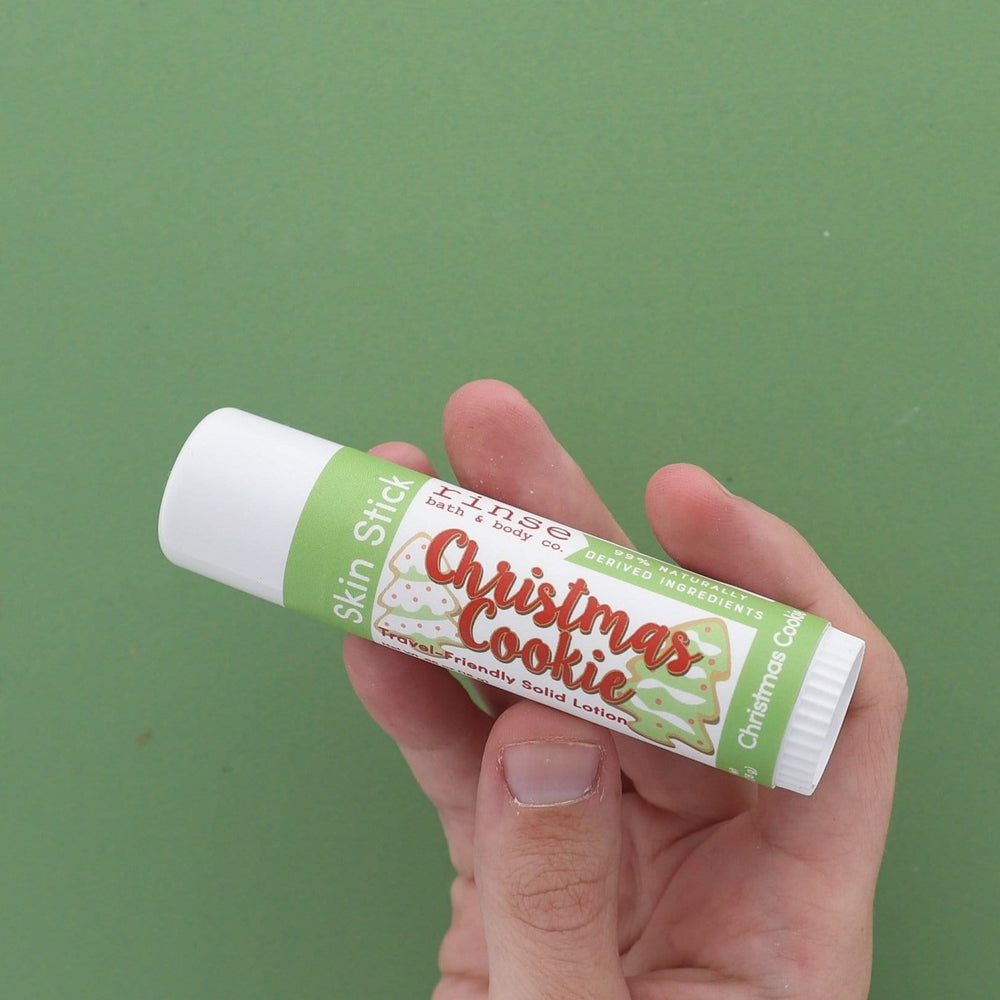 Christmas Cookie Skin Stick solid lotion stylized — sugar-cookie twist-up moisture bar on bright white