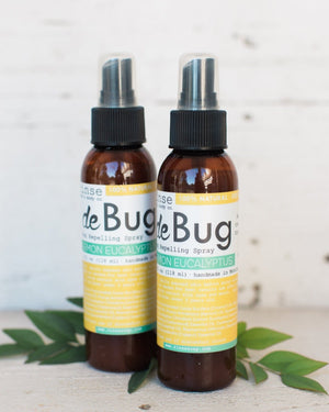 Two DeBug natural DEET-free bug repellent spray bottles by Rinse Bath & Body