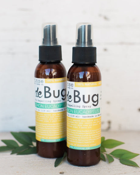 Two DeBug natural DEET-free bug repellent spray bottles by Rinse Bath & Body