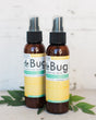 Two DeBug natural DEET-free bug repellent spray bottles by Rinse Bath & Body