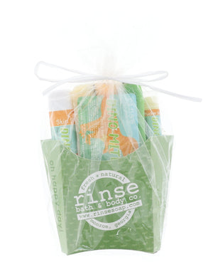 The Dino-Mite kids gift set wrapped in cellophane and tied with a ribbon bow — arrives gift-ready, no wrapping needed. Rinse Bath & Body Co.