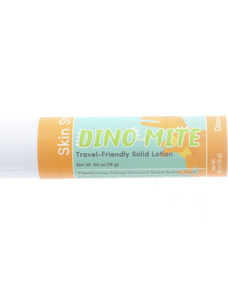 Dino-Mite Skin Stick solid lotion lying on bright white — orange dino silhouette label in clean studio light