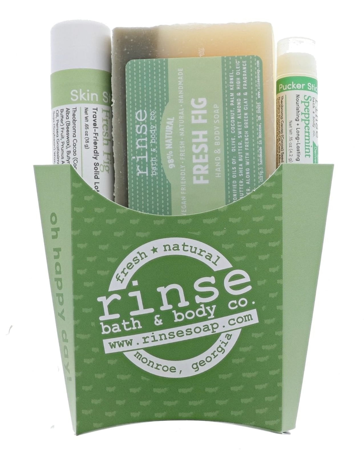 The Fresh Fig fry-box gift set in its green printed carton — Fresh Fig bar soap, Fresh Fig solid lotion skin stick and a Speppermint lip balm, ready to hand over. Rinse Bath & Body Co.