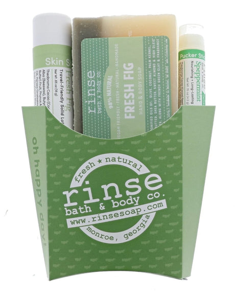 The Fresh Fig fry-box gift set in its green printed carton — Fresh Fig bar soap, Fresh Fig solid lotion skin stick and a Speppermint lip balm, ready to hand over. Rinse Bath & Body Co.