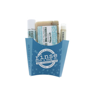Frosted Pine Cone gift set nestled in a blue oh-happy-day fry box — speckled soap and travel sticks on white