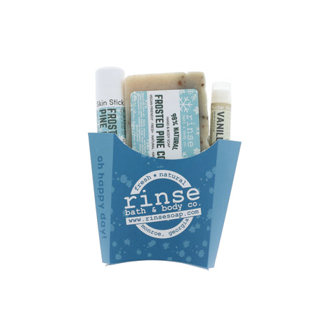 Frosted Pine Cone gift set nestled in a blue oh-happy-day fry box — speckled soap and travel sticks on white