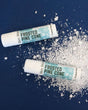 Frosted Pinecone solid lotion stick — cold winter evergreen in a twist-up moisture bar. Rinse Bath & Body Co.