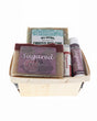 Frosted Pine and Sugared Fig holiday berry till packed with Peppermint balm and Skin Stick — wooden basket on bright white