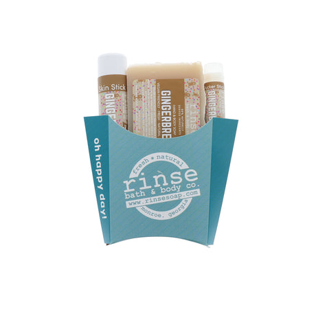 Gingerbread holiday trio nestled in a teal oh-happy-day fry box — creamy soap and travel sticks in studio light