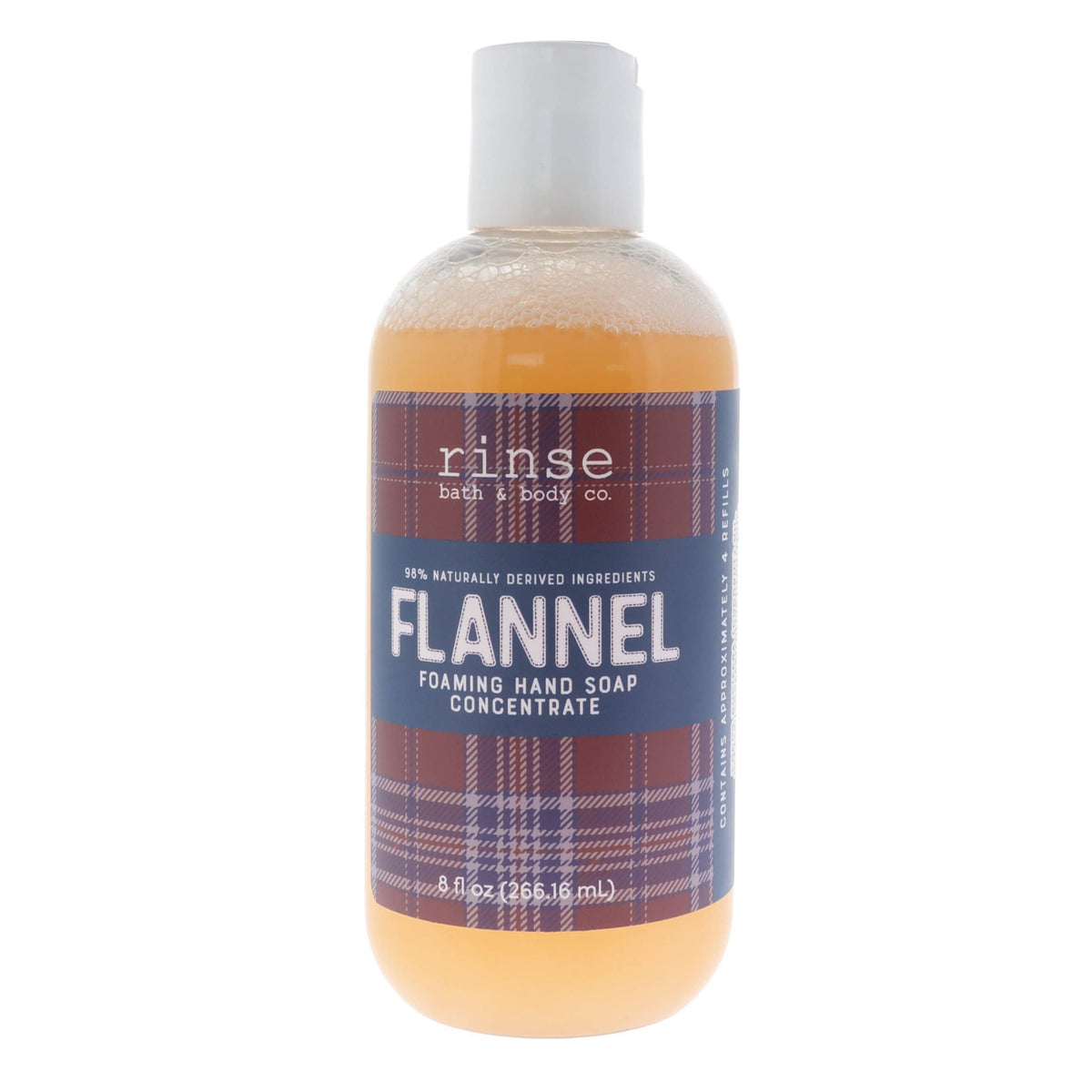 Flannel Foaming Hand Soap Concentrate standing on bright white — amber liquid and plaid label in clean studio light