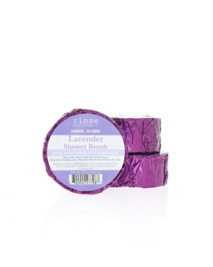 Two Lavender Shower Bombs stack in foil wrap with the current Rinse label; shown for display; listing is for one (1)