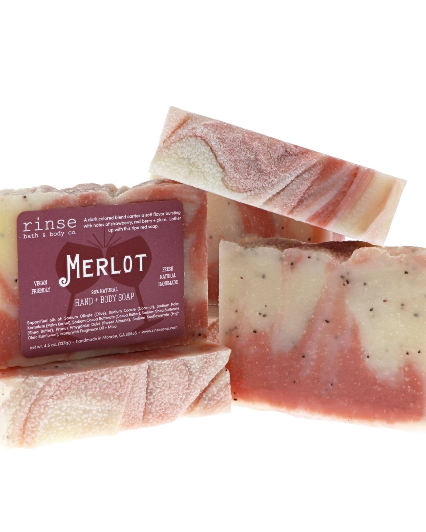 Merlot bar soap with its burgundy label facing out, stacked to show the poured swirl. Rinse Bath & Body Co.