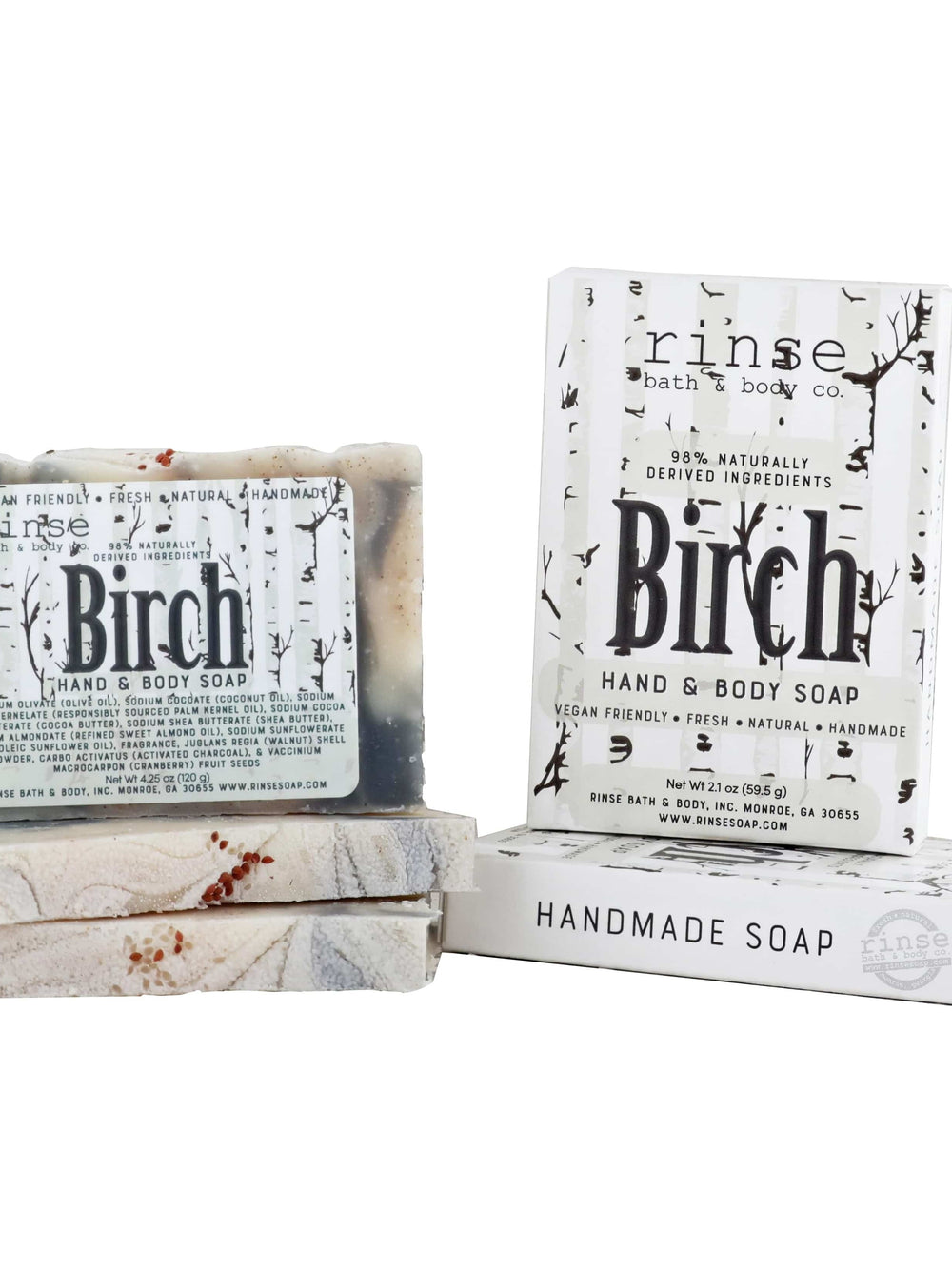 Marbled Birch mini soap bars stacked beside birch-tree cartons — creamy charcoal swirls on bright white