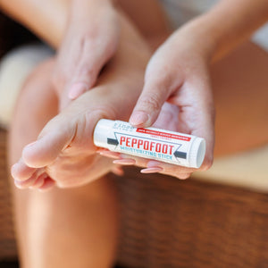 The Mini Peppofoot Stick, a travel-size twist-up tube of cooling peppermint foot balm — included in the Trying Natural discovery box. Rinse Bath & Body Co.