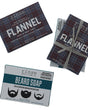Flannel and Beard Soap mini bars displayed on bright white — plaid and teal boxes with one pair tied in gray raffia