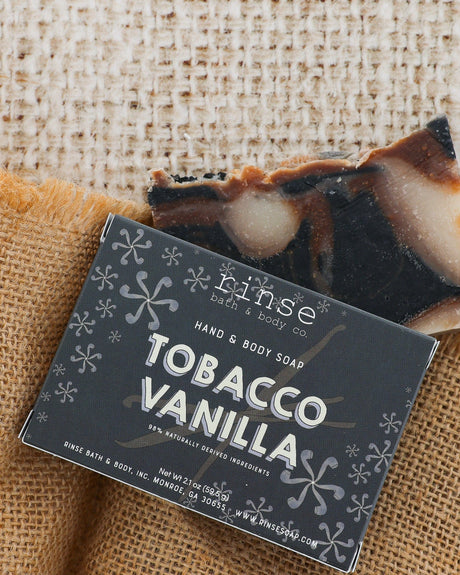 Tobacco Vanilla box and marbled bar on textured burlap in daylight — earthy tobacco and sweet vanilla