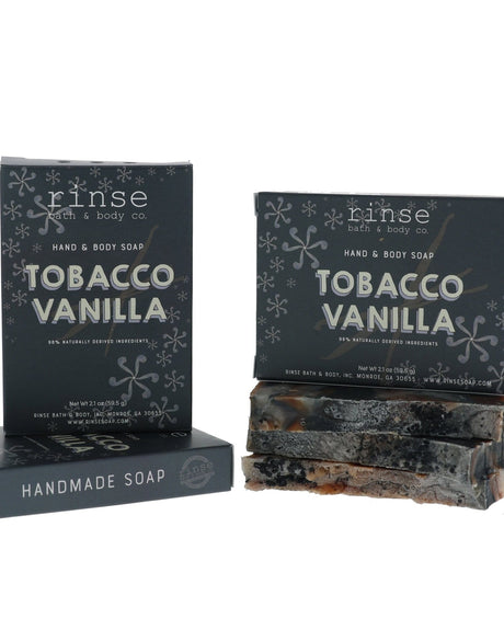 Tobacco Vanilla soap bars and charcoal boxes in bright studio light — warm tobacco and creamy vanilla