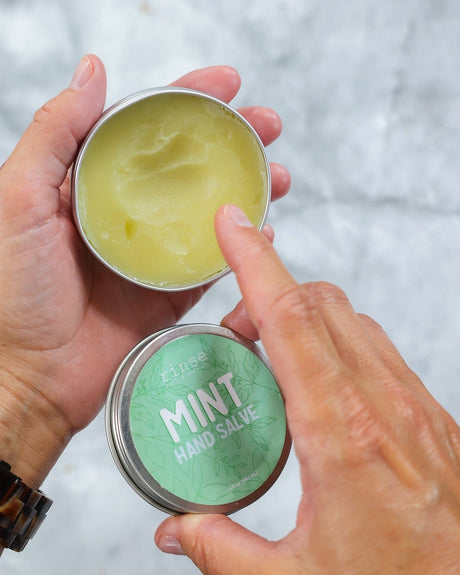 Mint Hand Salve tin held open in two hands