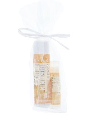 The Pumpkin Spice duo — solid lotion skin stick and lip balm pucker stick together, boxed and ready to give. Rinse Bath & Body Co.