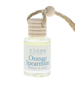 Small bottle of 'Orange Spearmint' perfume with a rope on a white background