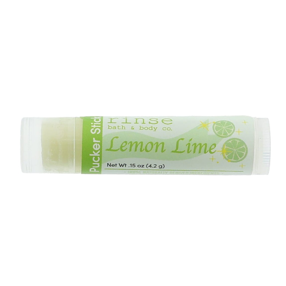 Lemon Lime Pucker Stick lying on bright white — light-green script and lime-slice graphics in studio light