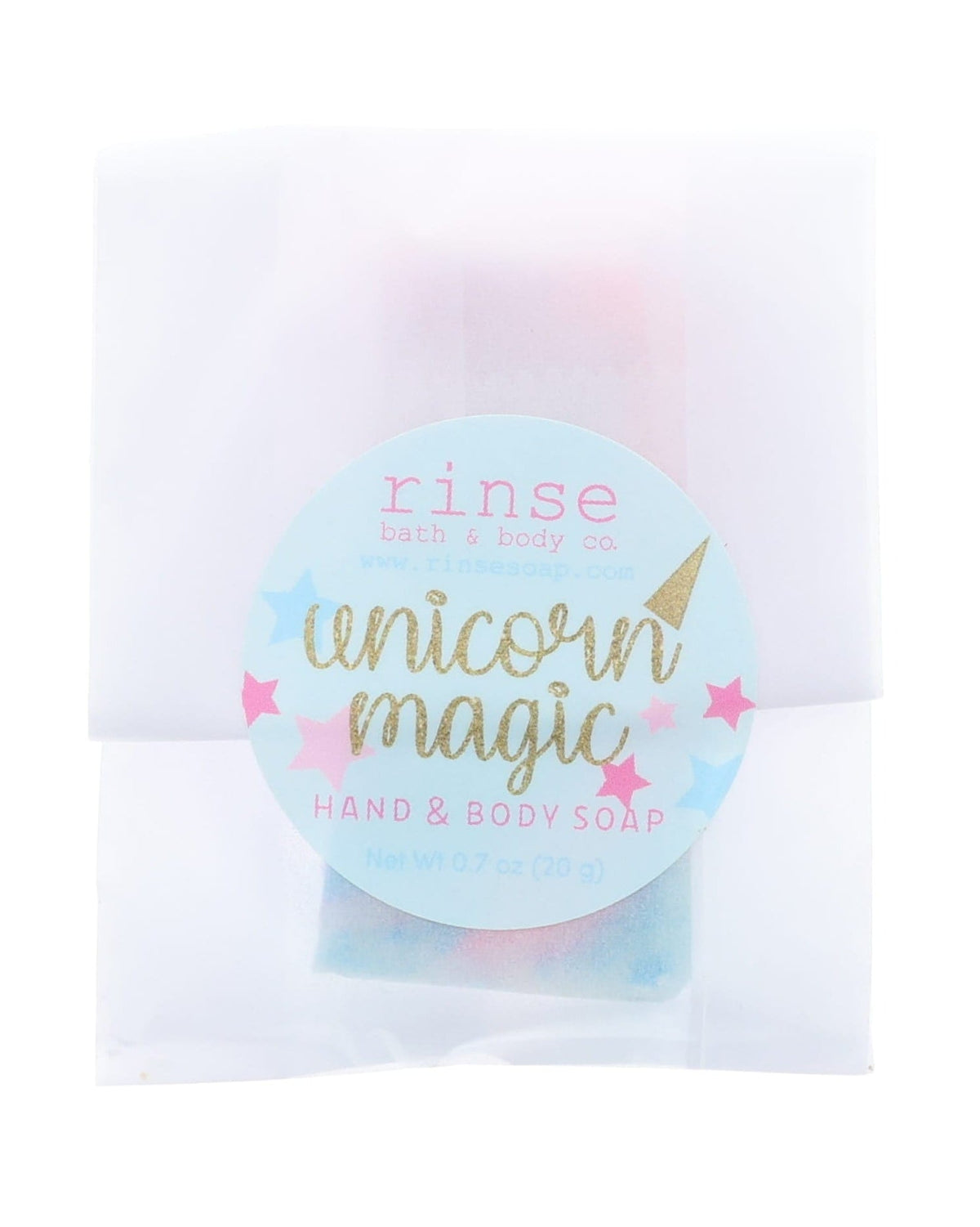 Unicorn Magic soap slice in translucent wrap — blue starry circle sticker on clean bright white
