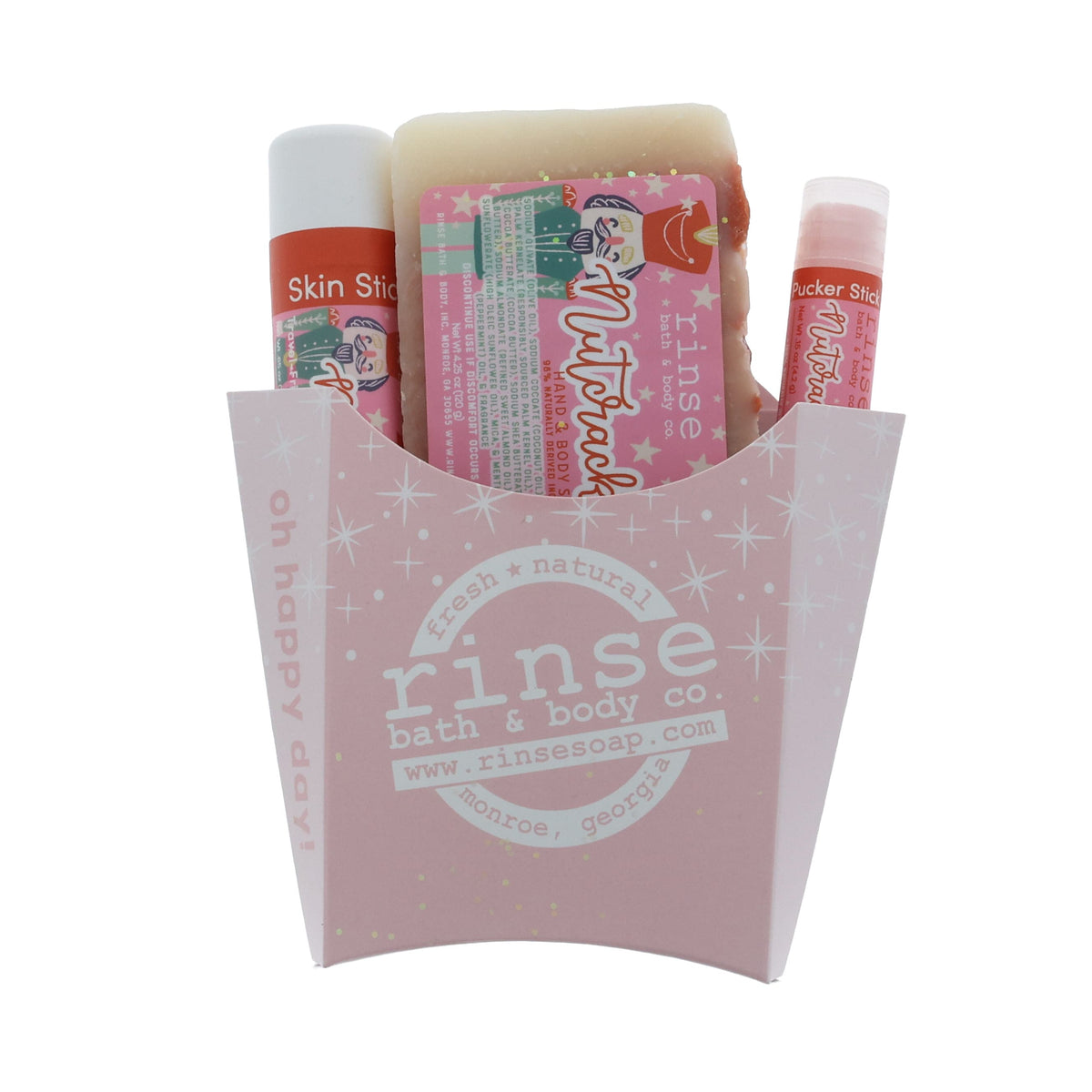 Nutcracker fry-box gift with soap and sticks peeking out — pale pink carton in clean studio light
