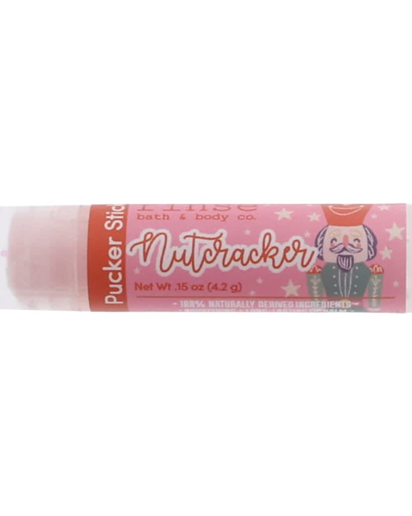 Nutcracker Pucker Stick lying on bright white — pink star label and nutcracker soldier in clean studio light — 4:5 card crop