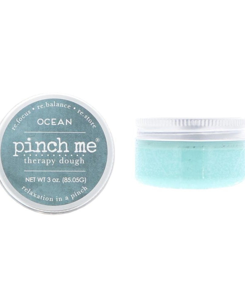 Ocean Pinch Me Therapy Dough tin standing on bright white — scented stress-relief dough in branded metal tin.