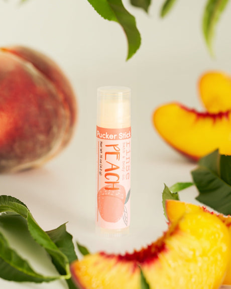 Peach lip balm — ripe summer peach in a cocoa-butter balm that isn't waxy. Rinse Bath & Body Co.